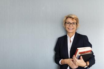 https://cf.ltkcdn.net/life/astrology/images/slide/341827-850x567-woman-with-books-1193056636.jpg