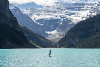 woman on paddle board at Lake Louise