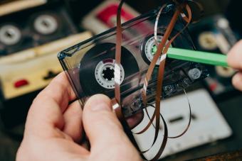 rewinding a cassette tape with a pencil