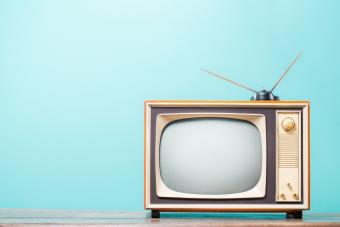 old-fashioned console TV with antenna