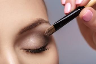 makeup artist apply makeup brush for eyes