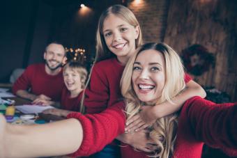 mother taking selfie with family