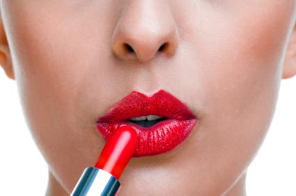 Applying lipstick