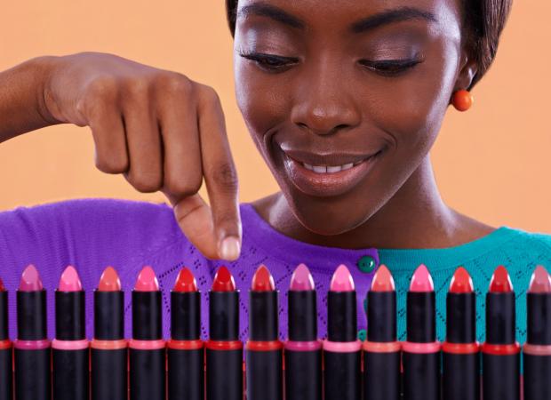 woman viewing colorful lipsticks