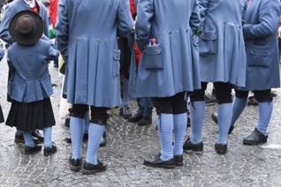 Men in period costumes with leggings