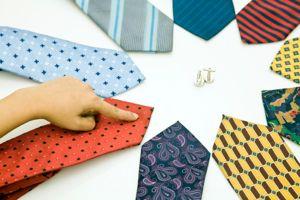 circle of ties with finger pointing