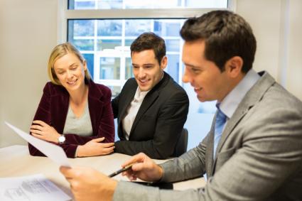 Clients and lender looking at documents