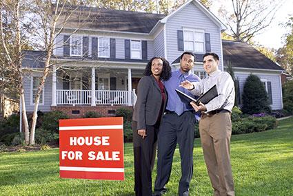 Couple with real estate agent