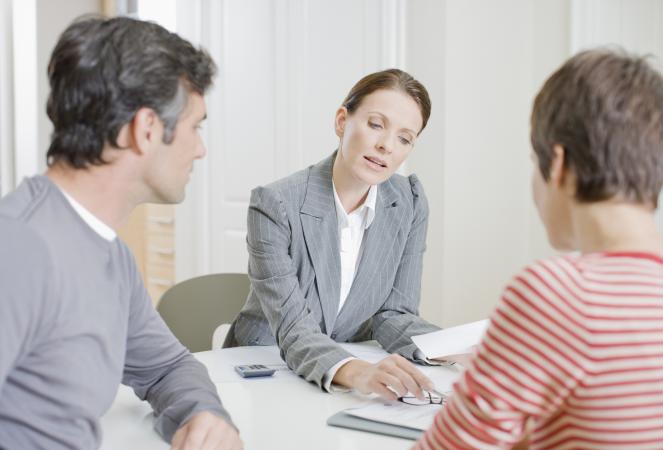 Couple meeting with mortgage originator