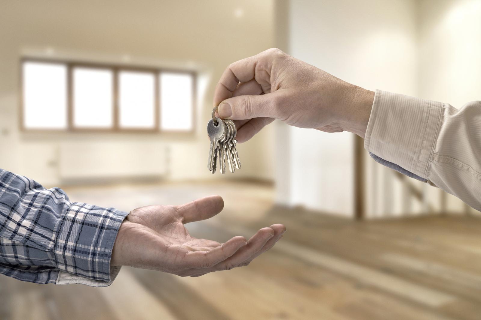 Realtor giving house key