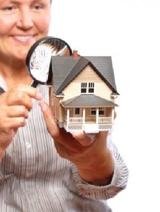 Woman inspecting house.