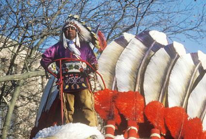 Native American on a float in Macy's 50th annual Thanksgiving Parade in New York City.