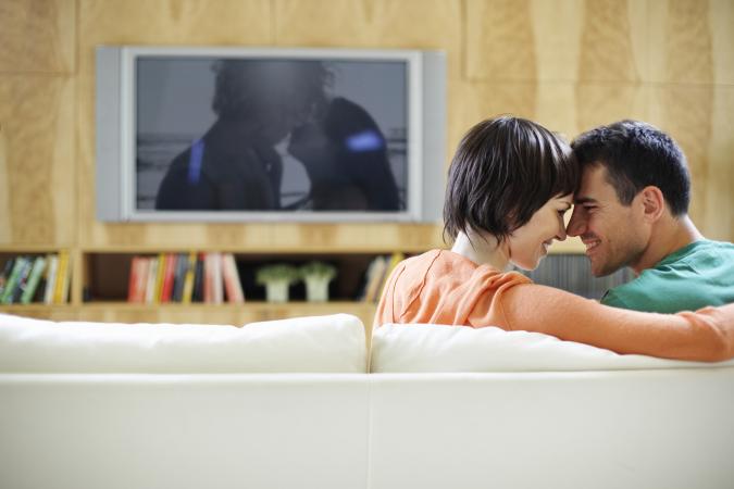 Intimate couple watching romantic movie