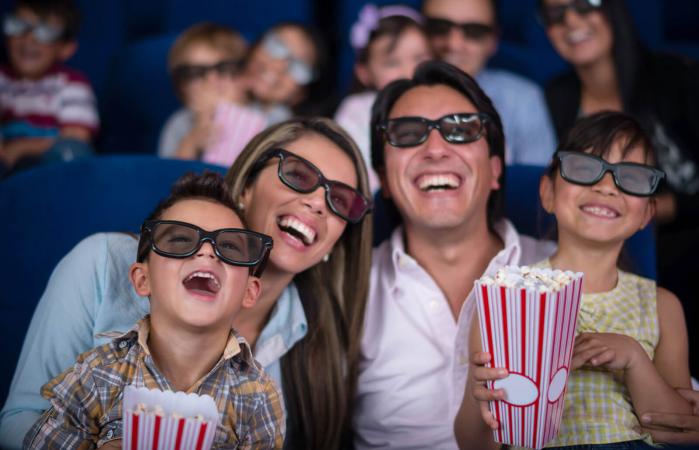 Family watching a 3D movie