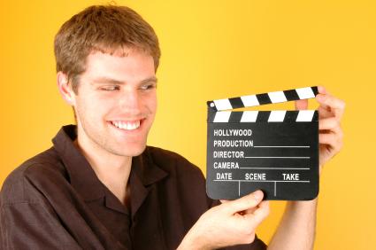 Film maker with clapboard.