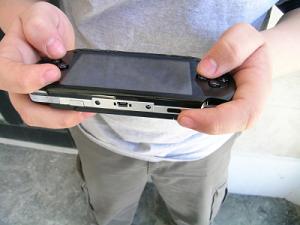 Kid playing PSP