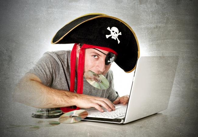 man downloading music and movies