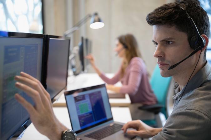 Tech person at desk with computer
