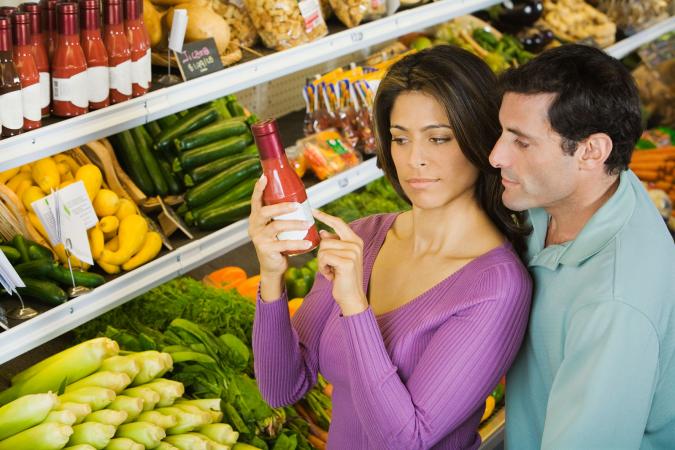 Couple reading food label