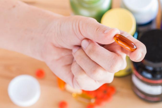 Person taking vitamins