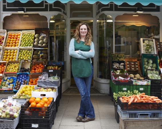 Grocer at Shop Entrance