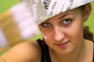 woman wearing a paper hat