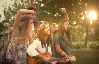 Hippies Dancing and Playing Guitar