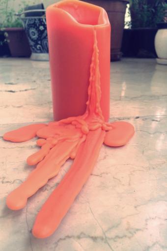 Melted Candle On Floor 