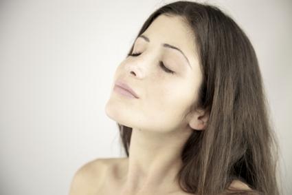 Woman relaxing with eyes closed