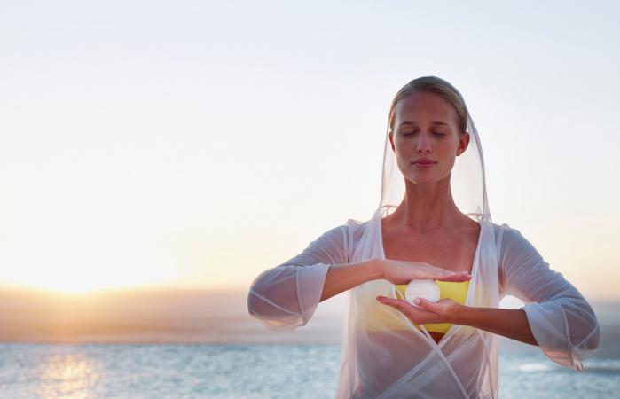 Woman with an orb between her hands
