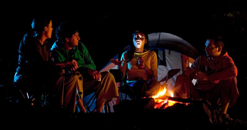 telling ghost stories around a campfire