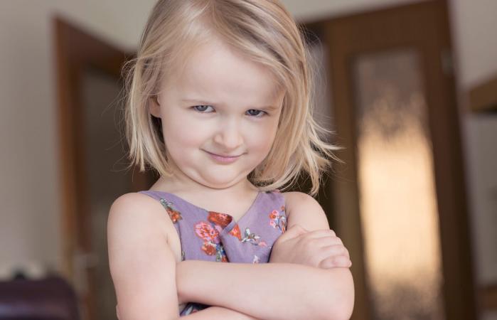 Child with arms folded