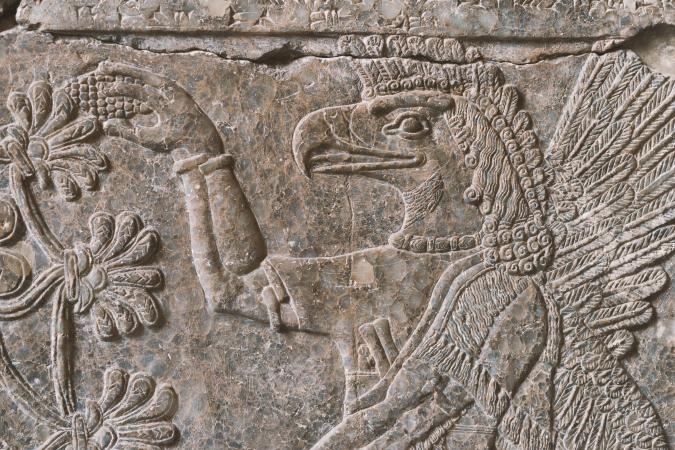 Ancient Assyrian limestone wall relief fragment of deity