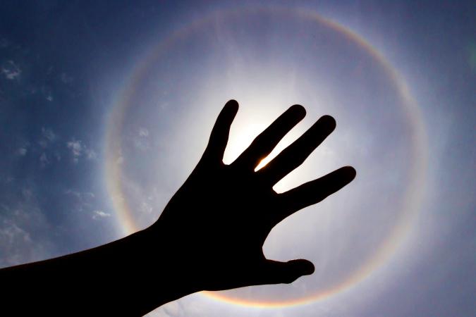 Halo phenomenon or sun with circular rainbow