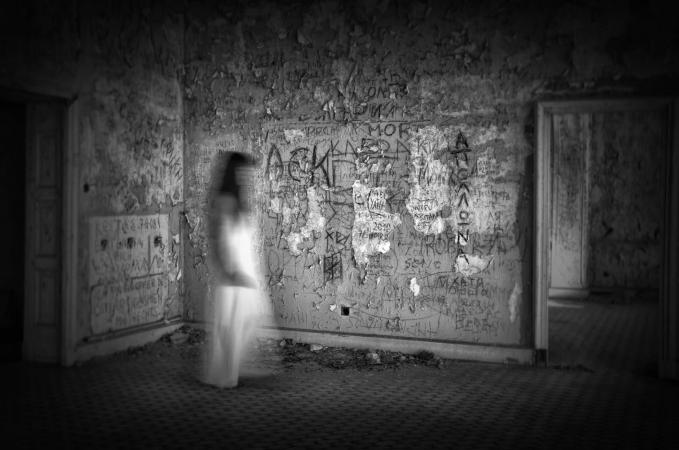 Blurred motion of woman walking