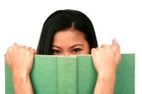 Woman holding book of ghost stories