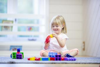 Little girl playing with blocks