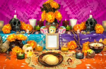 Traditional Mexican Day of the dead altar with sugar skulls