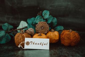 Giving thanks with pumpkin assortment still life and thankful message