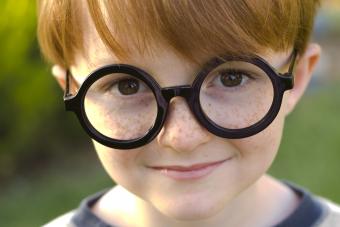 boy in round glasses at Harry Potter theme birthday party 