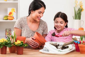 Mother and daughter potting plants at Easter time