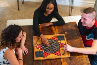 friends playing board game 