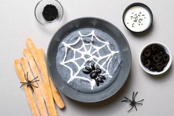 Black Hummus Halloween Dip Decorated with Cobweb and Spider