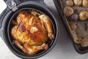 A whole chicken cooked inside an air frier 