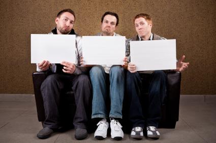 Guys playing a party game.