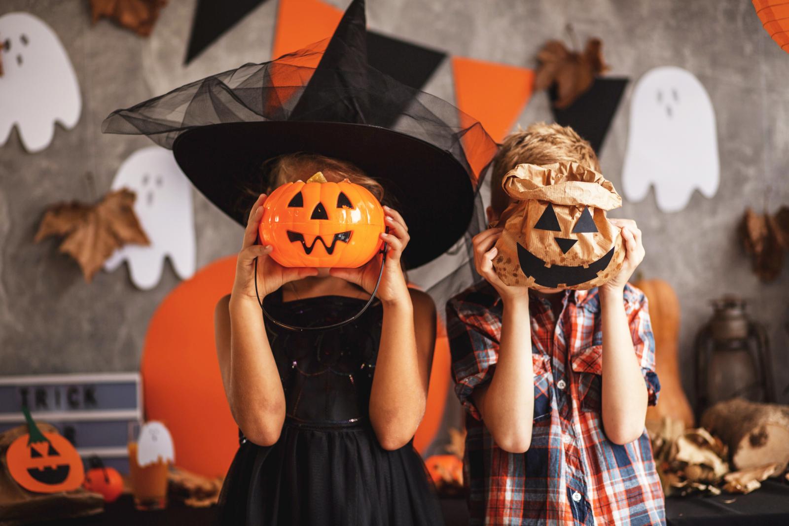 Boy and a girl are playing at the Halloween party
