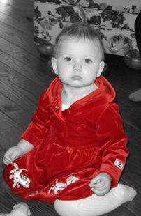 baby in red dress
