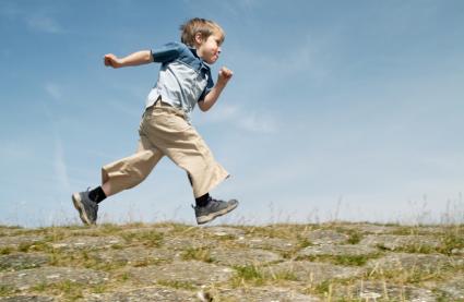 boy running on grass