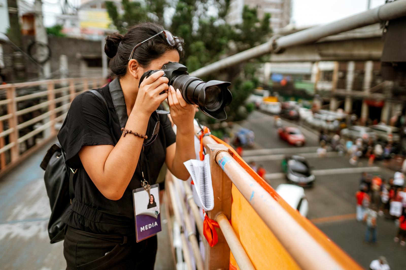 Photojournalist taking pictures