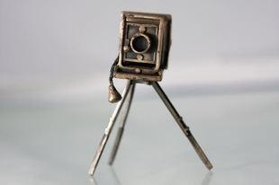 Antique cameras on tripods are great to display.